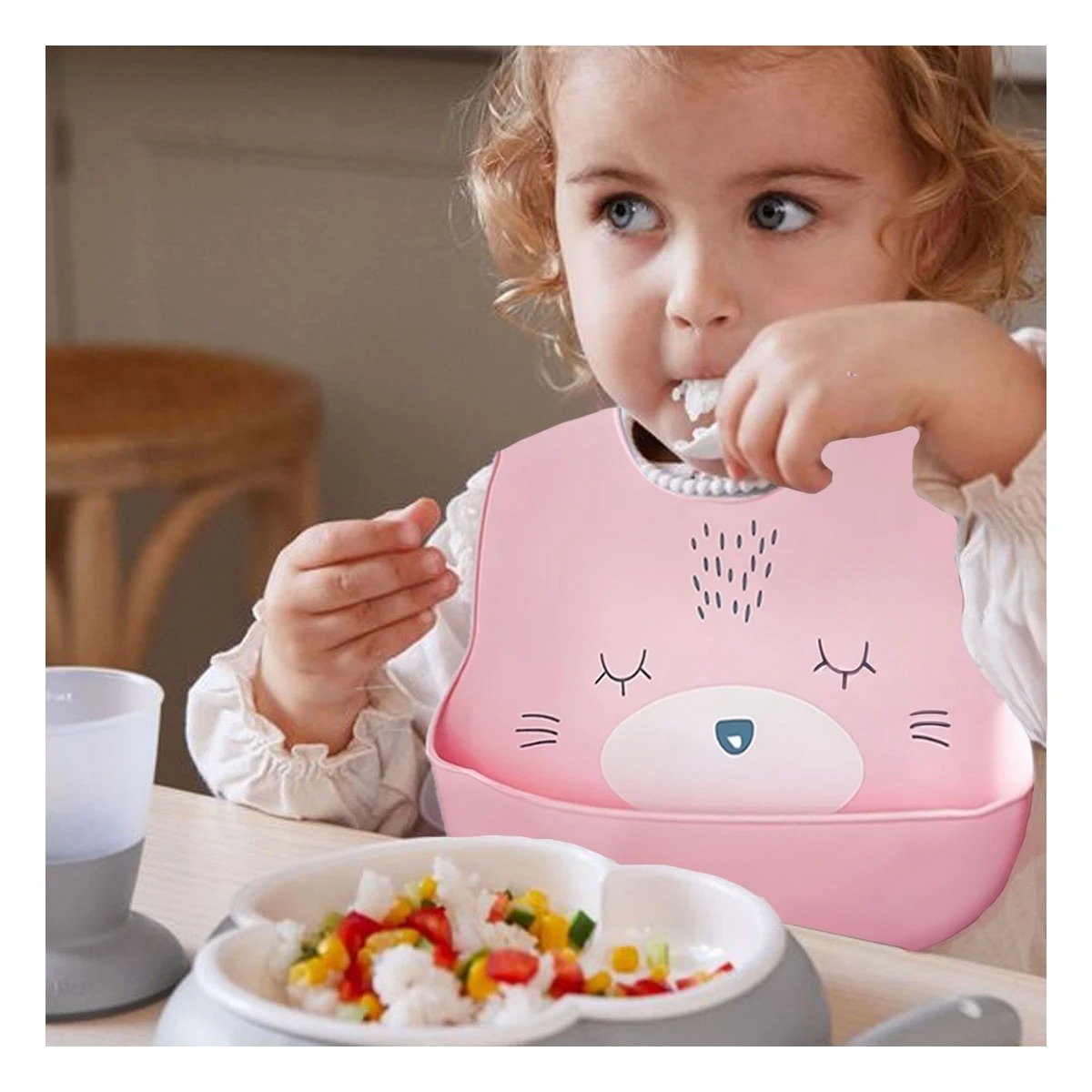 Babero Infantil de Silicona con Carita Rosado Practico y Ligera